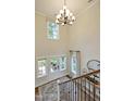 Grand foyer with high ceilings, elegant chandelier, and lots of natural light from windows at 4106 Sweet Ivy Lndg # 179, Durham, NC 27703