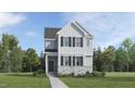 Charming two-story home with a well-manicured lawn, classic siding, and inviting front porch at 888 Cassa Clubhouse Way, Knightdale, NC 27545