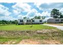 Beautiful single-story home with a well-maintained lawn and inviting curb appeal on a sunny day at 101 Cottonwood Ct, Kenly, NC 27542