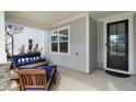 Relaxing front porch with seating area, perfect for enjoying the outdoors and neighborhood views at 1213 Remey Ave, Wake Forest, NC 27587