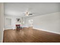 Spacious living room with hardwood floors, a fireplace, and plenty of natural light at 201 N Us 301, Micro, NC 27555