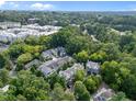 Aerial view of the townhome community surrounded by mature trees and landscaping at 515 Hillsborough St # 111, Chapel Hill, NC 27514