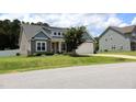 Attractive home showcasing well-maintained landscaping and a classic architectural design at 112 Star Valley Dr, Angier, NC 27501