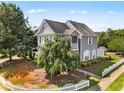 Charming two-story home with gray siding, white trim, and a well-maintained front yard and mature landscaping at 185 Sioux Ln, Clayton, NC 27520