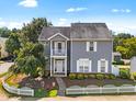 Charming two-story home with gray siding, white trim, and a well-maintained front yard at 185 Sioux Ln, Clayton, NC 27520