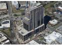 Aerial view of high-rise under construction, highlighting its modern design and location within a vibrant urban setting at 400 W Main St # 2002, Durham, NC 27701