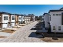 Wide street view of new construction townhomes showcases the community layout and design at 610 Walnut Hts Dr # 102, Raleigh, NC 27610