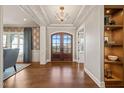 Bright and spacious entryway with hardwood floors and built-in shelving at 291 Riverstone Dr, Pittsboro, NC 27312