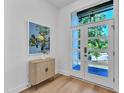 Bright foyer showcasing a stylish console table, eye-catching artwork, and a door featuring five glass panels at 2601 Mayview Rd, Raleigh, NC 27607