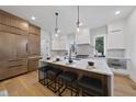 Spacious kitchen with island, white cabinets, and marble countertops at 2601 Mayview Rd, Raleigh, NC 27607