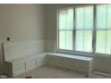 Bright interior nook featuring custom built in seating and a large window with natural light at 72 Hazelwood, Pittsboro, NC 27312