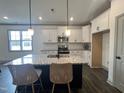 Bright kitchen featuring a spacious island and granite countertops at 345 Maidenhair Pl, Clayton, NC 27520