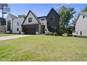 Charming home with stylish finishes, manicured lawn, and inviting curb appeal in a leafy neighborhood at 5307 Dixon Dr, Raleigh, NC 27609