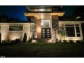 Stunning stone and siding home with modern architectural details and professional landscaping at 213 Westhampton Dr, Pittsboro, NC 27312