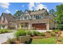 Two-story brick home with attached garage and nicely landscaped front yard at 405 Bridgewater Dr, Sanford, NC 27330
