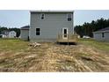 Gray siding two-story house with deck and backyard at 258 Rocking Horse Ln, Sanford, NC 27332