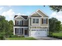 Two-story house with green siding, a two-car garage, and landscaping at 30 Willow Walk (Lot 460) Way, Cameron, NC 28326