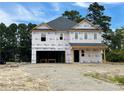 Two-story house under construction, wrapped in protective covering at 2833 Sheriff Watson Rd, Sanford, NC 27332