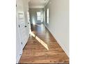 Bright hallway with hardwood floors and natural light at 35 Fort Mcclary Ct, Cameron, NC 28326