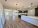 Open concept kitchen with island and living room view at 35 Fort Mcclary Ct, Cameron, NC 28326