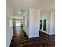 Bright entryway with hardwood floors, leading to the kitchen and other rooms at 36 Fort Mcclary Ct, Cameron, NC 28326