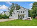 Beautiful two-story home boasts well-kept lawn, two-car garage, and inviting entrance at 60 Hunters Way, Angier, NC 27501
