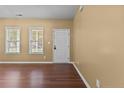Inviting living room featuring gleaming hardwood floors, neutral walls, and plenty of natural light at 60 Hunters Way, Angier, NC 27501