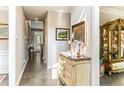 Bright hallway featuring hardwood floors and decorative furniture at 367 Falling Water Rd, Spring Lake, NC 28390