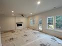 Finished basement featuring a fireplace and access to the backyard at 114 Kingwood Dr, Lillington, NC 27546