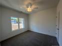 Bright bedroom with carpet and a large window at 114 Kingwood Dr, Lillington, NC 27546