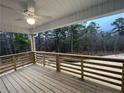 Wooden deck overlooking a wooded area at 114 Kingwood Dr, Lillington, NC 27546