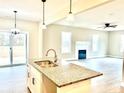 Kitchen island with double sink and granite countertop at 125 Shadybrook Dr, Benson, NC 27504