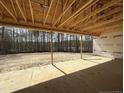 Covered patio under construction with a view of the treeline at 1275 Cameron Hill Rd, Cameron, NC 28326