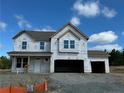 New construction home with a two-car garage and front porch at 60 Steeple (Lot 598) Rdg, Cameron, NC 28326