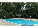 Community swimming pool with a pergola and surrounding fence at 60 Steeple (Lot 598) Rdg, Cameron, NC 28326