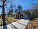 Newly built home with a gray exterior and a red front door at 910 West St, Smithfield, NC 27577