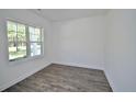 Minimalist living room with a large window providing ample natural light at 2885 Lemuel Black Rd, Bunnlevel, NC 28323