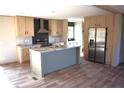 Bright kitchen with stainless steel appliances, a center island, and modern finishes at 16 Industrial Dr, Bunnlevel, NC 28323