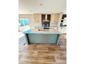 Modern kitchen with a center island featuring a sink and stylish countertop at 16 Industrial Dr, Bunnlevel, NC 28323