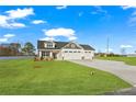 Beautiful single-Gathering home with well-kept lawn, a driveway, and a three-car garage at 32 Boyce Ct, Sanford, NC 27332