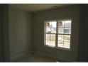 Bright bedroom featuring a large window offering plenty of natural light at 123 Nectar Ln, Bunnlevel, NC 28323