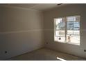 Unfurnished bedroom with drywall and a large window at 137 Nectar Ln, Bunnlevel, NC 28323