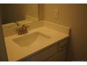 A modern bathroom features a sink with white countertops and vanity at 154 Nectar Ln, Bunnlevel, NC 28323