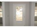 Bright entryway featuring a glass-paneled door and neutral wall paint at 174 Nectar Ln, Bunnlevel, NC 28323