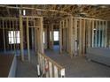 Interior framing of a new home showcasing an open floor plan at 174 Nectar Ln, Bunnlevel, NC 28323