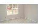 A bright and airy room featuring a large window, ready for customization at 174 Nectar Ln, Bunnlevel, NC 28323