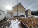 Unfinished two-story house exterior with construction materials visible and a snowy yard at 196 Hook Dr # 9, Fuquay Varina, NC 27526