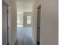 Bright hallway with light gray wood-look flooring, leading to living spaces at 4983 (Lot 3) Ray Rd, Spring Lake, NC 28390