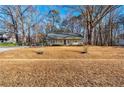 Gray ranch home with yellow shutters and a spacious yard at 505 Hiking Trl, Benson, NC 27504