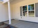 Covered front porch with a white railing and gray shutters at 5011 (Lot 5) Ray Rd, Spring Lake, NC 28390